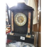 A black slate/marble mantel clock.