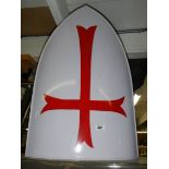 A metal Knights Templar replica shield.