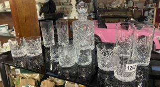 A cut glass decanter & a quantity of glasses