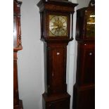 A good brass square dial long case clock on three bells by Matthew Bufnell,