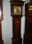 A good brass square dial long case clock on three bells by Matthew Bufnell,