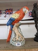 A Royal Dux figure of a macaw.