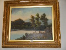 A gilt framed oil on canvas rural scene.