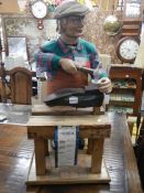 An early 20th century cobblers shop window display figure, needs repair, COLLECT ONLY.