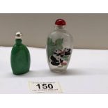 A Chinese perfume bottle hand painted with pandas and another Chinese perfume bottle.