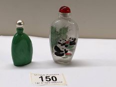 A Chinese perfume bottle hand painted with pandas and another Chinese perfume bottle.