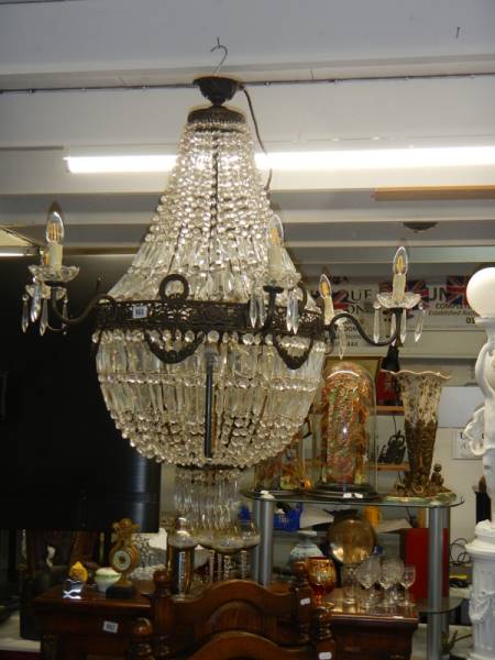 A fabulous brass 'basket' chandelier with over 4000 crystals. COLLECT ONLY.