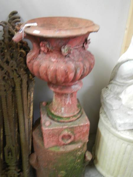 A terracotta style urn on pedestal, a/f.