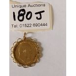 An Edward VII full sovereign, 1910, mounted on 9ct gold pendant, gross weight 9.64 grams.