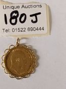 An Edward VII full sovereign, 1910, mounted on 9ct gold pendant, gross weight 9.64 grams.
