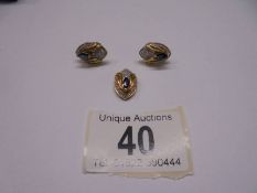 An 18ct gold sapphire and diamond pendant and earring set. 7.3 grams.