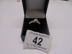 A white gold square shaped diamond ring, size N, 2.7 grams
