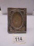 An Adam style silver photo frame, 9 x 7 cm.