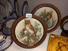A pair of signed Italian porcelain with wood back plaques depicting birds