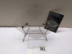 A Vitra Design Museum 1/6 scale Harry Bertoia diamond chair.