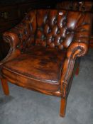 A good quality tan leather deep buttoned arm chair. COLLECT ONLY.