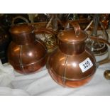 A pair of copper lidded pots by E W Bachman, Guernsey.