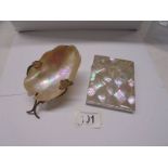 A mother of pearl engraved card case and an art deco mother of pearl caviar dish.
