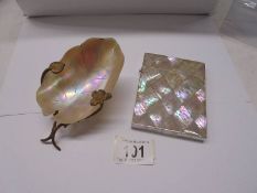 A mother of pearl engraved card case and an art deco mother of pearl caviar dish.