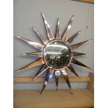 A sunburst mirror. COLLECT ONLY.