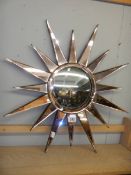 A sunburst mirror. COLLECT ONLY.