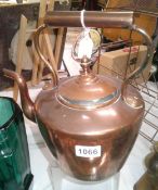 A victorian copper kettle.