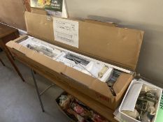 A boxed Brother knitting machine with accessories, manuals & folding table (model KR-850)