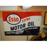 An Esso Motor Oil sign.