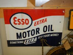 An Esso Motor Oil sign.