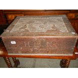 An 18th century carved bible box in need of restoration. COLLECT ONLY.