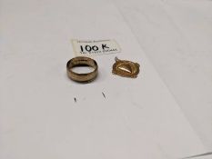 A gold wedding ring and a gold watch fob. 7 grams.