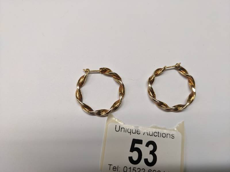 A pair of 9ct gold twisted design hoop earrings, 2.3 grams. - Image 2 of 4