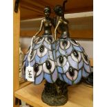 A Tiffany style table lamp featuring dancing ladies.