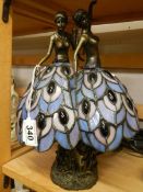 A Tiffany style table lamp featuring dancing ladies.