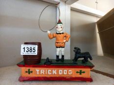 A cast iron trick dog novelty money box