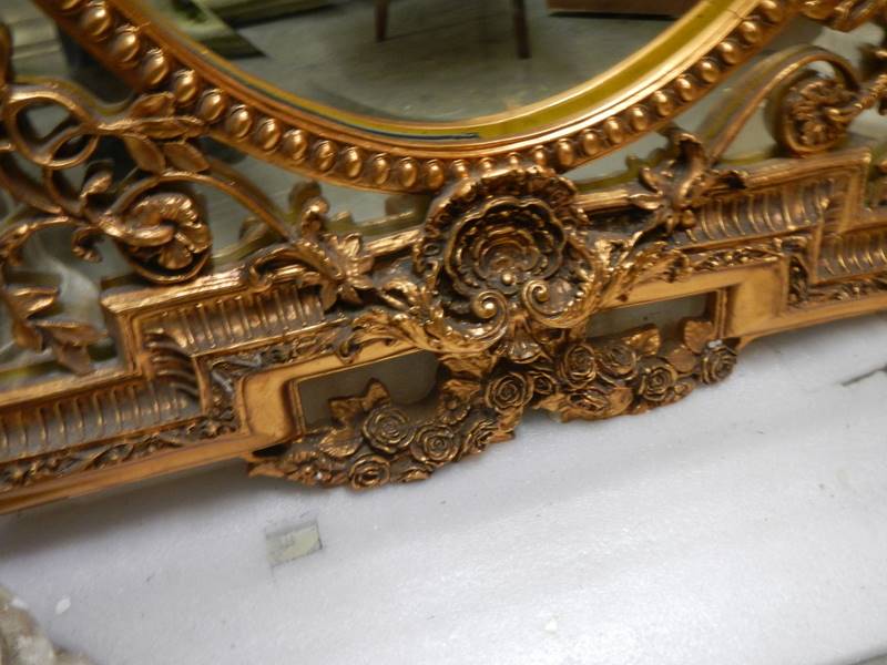 An oval mirror in an ornate gilt frame. COLLECT ONLY. - Image 5 of 5