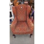 An Edwardian wing arm chair