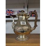 An unusual silver plate coffee pot the dragon spout.