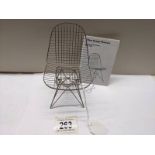 A Vitra Design Museum 1/6 scale Charles R Ray games model wire chair.