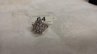 A diamond cluster ring, approximately 1.75 carats total in a starburst design, 14ct white gold set