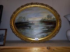 A gilt framed oval oil on board of a lone fisherman, signed A E Webster - 58cm x 48cm (COLLECT