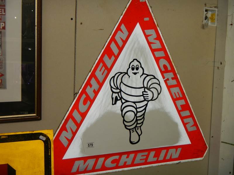 A triangular Michelin Man sign.