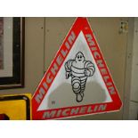 A triangular Michelin Man sign.