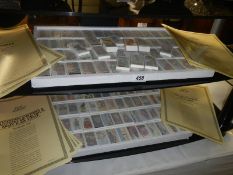 Approximately 100 sets of replica cigarette cards with certificates.