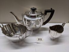 A three piece silver plate tea set.