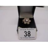 A large floral yellow gold diamond ring, size P, 4.3 grams.
