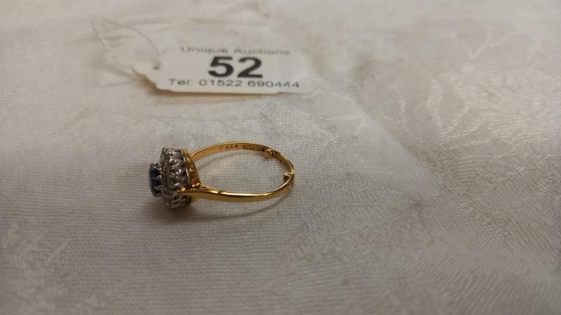 A diamond and sapphire cluster ring, dated and hall marked Birmingham 1967, size N half, 3.4 grams. - Image 3 of 4