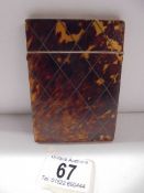 A tortoiseshell card case.