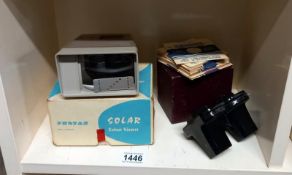A vintage Sawyers view master, discs & boxed slide viewer