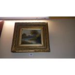 A gilt framed late 19th century/early 20th river scene oil on canvas signed but indistinct, some